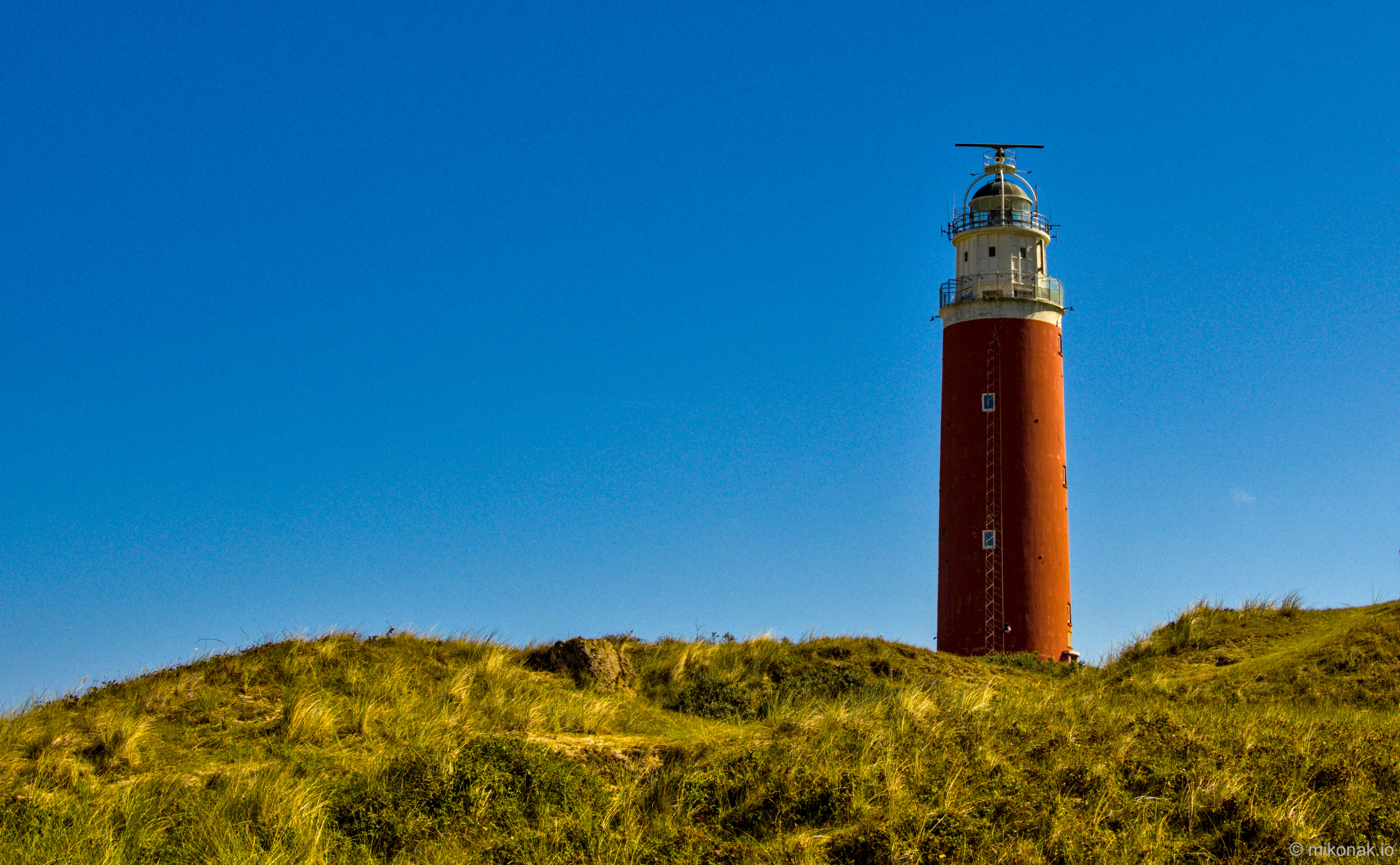 Lighthouse on Sandy Dunes